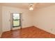 Bedroom featuring a wood floor, a window, and ceiling fan; ready to be personalized to taste at 1612 Blue Lake Cir, Punta Gorda, FL 33983