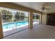 This screened lanai offers direct access to a sparkling pool, blending indoor and outdoor living seamlessly at 1612 Blue Lake Cir, Punta Gorda, FL 33983