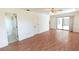 Living room featuring wood flooring, tile flooring, and a sliding door at 1612 Blue Lake Cir, Punta Gorda, FL 33983