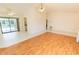 Bright living room with tile and wood flooring, fan, and sliding door to pool area at 1612 Blue Lake Cir, Punta Gorda, FL 33983