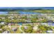 Picturesque aerial perspective of canal-front homes, docks, and streets winding through a beautiful neighborhood at 17368 Skipper Ln, Port Charlotte, FL 33948