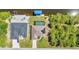 An aerial view reveals a backyard pool, alongside a waterway with boat dock at 17368 Skipper Ln, Port Charlotte, FL 33948