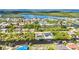 Scenic aerial shot of waterfront properties, private boat docks, and winding canals in a tranquil neighborhood setting at 17368 Skipper Ln, Port Charlotte, FL 33948