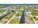 Beautiful aerial view of waterfront homes with boat docks along canals in a stunning residential neighborhood at 17368 Skipper Ln, Port Charlotte, FL 33948