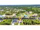 Aerial view of a home on a canal, showcasing the waterfront property and community at 17368 Skipper Ln, Port Charlotte, FL 33948