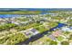 Gorgeous aerial view showcases waterfront homes, boat docks, winding canals, and mature trees in a serene setting at 17368 Skipper Ln, Port Charlotte, FL 33948