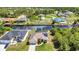 An aerial view of a community located on a waterway, with mature trees and manicured lawns at 17368 Skipper Ln, Port Charlotte, FL 33948