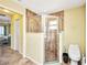 Modern bathroom featuring a glass enclosed shower with tiled walls and a light yellow wall color at 17368 Skipper Ln, Port Charlotte, FL 33948