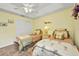Bright bedroom featuring twin beds, neutral walls, ceiling fan, and closet for ample storage at 17368 Skipper Ln, Port Charlotte, FL 33948