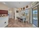 Cozy dining area with a table, chandelier, and sliding glass doors leading to the pool at 17368 Skipper Ln, Port Charlotte, FL 33948