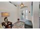 Inviting foyer features a decorative light fixture, and a frosted glass front door at 17368 Skipper Ln, Port Charlotte, FL 33948