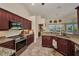 Open kitchen featuring granite countertops, stainless appliances and views to dining area and the pool at 17368 Skipper Ln, Port Charlotte, FL 33948