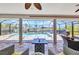 A view from the lanai looking out onto the screened pool area and scenic waterfront at 17368 Skipper Ln, Port Charlotte, FL 33948