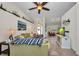 Spacious living room with tile flooring, ceiling fan, view to the foyer and sitting room at 17368 Skipper Ln, Port Charlotte, FL 33948