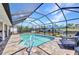 Private screened pool and deck provides a refreshing escape with waterfront views at 17368 Skipper Ln, Port Charlotte, FL 33948