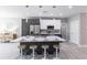 Modern kitchen with stainless steel appliances, an island with bar seating, and sleek cabinetry at 19160 Ruskin Ave, Port Charlotte, FL 33954