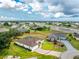 An aerial view of a well-maintained property with lush green lawn and mature landscaping near a waterway at 2168 Calcutta Rd, Punta Gorda, FL 33983