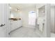 Bright bathroom features double sinks, white cabinets, and a tiled shower at 2168 Calcutta Rd, Punta Gorda, FL 33983
