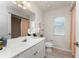 Bathroom featuring a white vanity with granite countertop and a decorative flower at 2168 Calcutta Rd, Punta Gorda, FL 33983