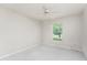 Bedroom featuring carpet, a ceiling fan, and a window with blinds at 2168 Calcutta Rd, Punta Gorda, FL 33983