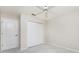 Carpeted bedroom with a ceiling fan and double closet at 2168 Calcutta Rd, Punta Gorda, FL 33983