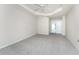 Bedroom with neutral carpet, ceiling fan, and bright, neutral paint at 2168 Calcutta Rd, Punta Gorda, FL 33983