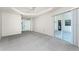 Large bedroom featuring carpet, ceiling fan, and sliding glass door to lanai at 2168 Calcutta Rd, Punta Gorda, FL 33983