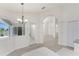 Elegant dining area with large windows, offering views and ample natural light and easy pool access at 2168 Calcutta Rd, Punta Gorda, FL 33983
