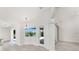 Bright dining area with a view of the pool area, providing a serene and relaxing atmosphere for meals at 2168 Calcutta Rd, Punta Gorda, FL 33983