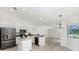 Bright kitchen with stainless steel appliances, island, and breakfast bar, perfect for cooking and entertaining at 2168 Calcutta Rd, Punta Gorda, FL 33983