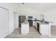 Modern kitchen with island, stainless steel appliances, and ample counter space, great for meal preparation at 2168 Calcutta Rd, Punta Gorda, FL 33983