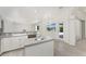 Bright kitchen with an island and direct access to the outdoor pool area, great for entertaining guests at 2168 Calcutta Rd, Punta Gorda, FL 33983