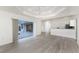 Open living area with pool access and kitchen view, great for entertaining and Gathering gatherings at 2168 Calcutta Rd, Punta Gorda, FL 33983