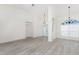 Spacious living room with gray flooring and cathedral ceilings, leading to multiple entryways at 2168 Calcutta Rd, Punta Gorda, FL 33983