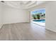 Bright living room with sliding glass doors leading to the pool, perfect for enjoying the Florida sunshine at 2168 Calcutta Rd, Punta Gorda, FL 33983