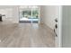 Bright, open living room with gray flooring and cathedral ceilings, offering a view of the pool area at 2168 Calcutta Rd, Punta Gorda, FL 33983