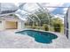Private pool with a screened enclosure, patio, and well-manicured landscaping at 2168 Calcutta Rd, Punta Gorda, FL 33983