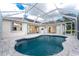 Enjoy the refreshing pool in this screened-in lanai connected to the home's living spaces at 2168 Calcutta Rd, Punta Gorda, FL 33983