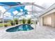Enclosed pool and patio with scenic sky views, accessible through screened-in lanai at 2168 Calcutta Rd, Punta Gorda, FL 33983