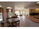 Bright and airy living space with dining and kitchen area, showcasing ample natural light and open design at 23090 Ambassador Ave, Port Charlotte, FL 33954