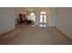 Spacious living area with a dining room, showcasing an open layout and natural light, perfect for Gathering time at 23090 Ambassador Ave, Port Charlotte, FL 33954