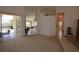 Open floor plan features a seamless transition to a dining and kitchen area, ideal for modern living at 23090 Ambassador Ave, Port Charlotte, FL 33954