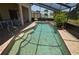 Enclosed pool with clear water, gradual steps, and a large patio area for lounging at 23090 Ambassador Ave, Port Charlotte, FL 33954