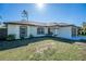 Well-maintained one-story home with fresh landscaping and a welcoming facade at 2405 Mistleto Ln, North Port, FL 34286