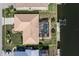 Aerial view showcasing the home's property line, pool, and waterfront access with dock at 2526 Rio Plato Dr, Punta Gorda, FL 33950