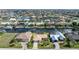 Waterfront home with a pool, enclosed lanai, boat dock, and landscaped yard on a canal at 2526 Rio Plato Dr, Punta Gorda, FL 33950