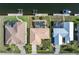 Aerial view of house showing the pool, lanai, dock, and well-manicured lawn at 2526 Rio Plato Dr, Punta Gorda, FL 33950
