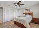 Bedroom features an accent wall, spacious closets, and a decorative ceiling fan at 2526 Rio Plato Dr, Punta Gorda, FL 33950