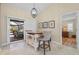 Cozy dining area with custom island and barstools, leads to outdoor living space at 2526 Rio Plato Dr, Punta Gorda, FL 33950
