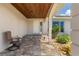 Inviting front porch with stone accents, neutral paint, and manicured landscaping at 2526 Rio Plato Dr, Punta Gorda, FL 33950